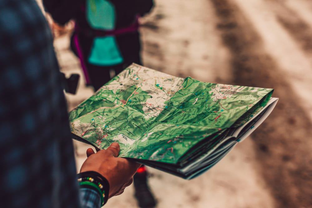 A person holding a map 