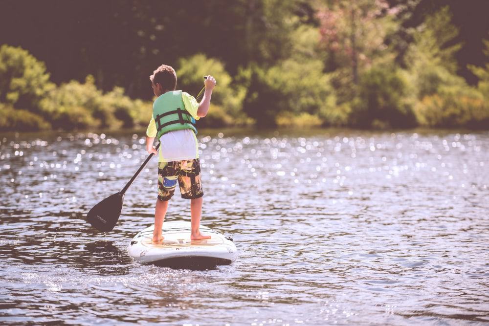 A child paddleboarding