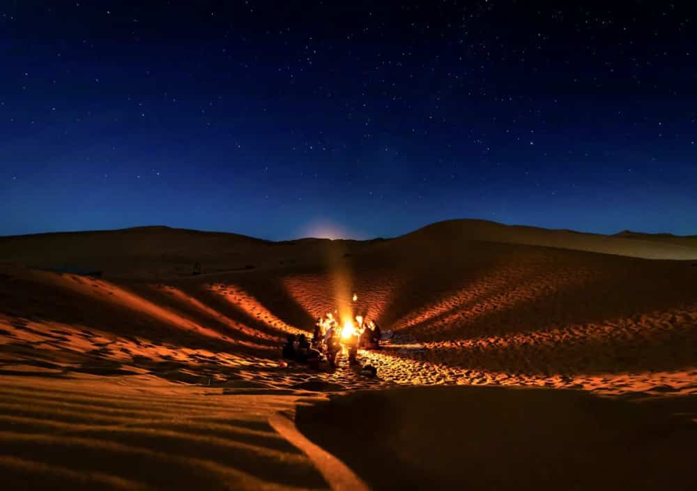 Campfire in desert with friends