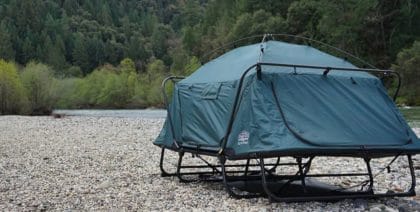 Double cot tent set up on a gravel riverbank highlighting the places they can cope being set up in.